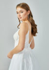 Bride wearing a soft tulle A-line gown with plunging illusion neckline and embroidered bodice from Casa Reina Bridal Collection