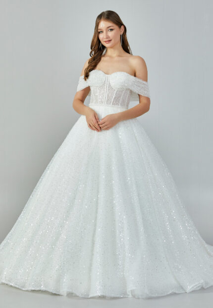 Bride wearing a crystal-embellished off-shoulder corset ball gown with glittering tulle skirt from Casa Reina Bridal Collection