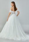 Bride wearing a crystal-embellished off-shoulder corset ball gown with glittering tulle skirt from Casa Reina Bridal Collection