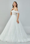 Bride wearing a crystal-embellished off-shoulder corset ball gown with glittering tulle skirt from Casa Reina Bridal Collection