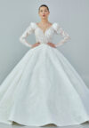 Bride wearing a regal embroidered ballgown with illusion long sleeves and crystal bead detailing from Casa Reina Bridal Collection