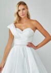 Bride wearing an asymmetrical satin ballgown with draped shoulder and beaded sweetheart neckline from Casa Reina Bridal Collection