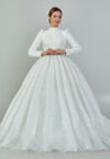 Bride wearing a high-neck long sleeve ball gown with hand-beaded detailing and cathedral train from Casa Reina Bridal Collection